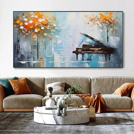 Abstract tree landscape oil painting above a sofa styled with orange pillow accents and marble decor
