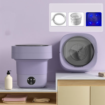Purple foldable washing machine with inset images of the included drain pipe, drain basket and blue light drum