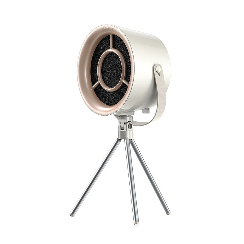 Milky white extractor fan on its adjustable tripod, black carbon filter visible behind the rose-gold front ring
