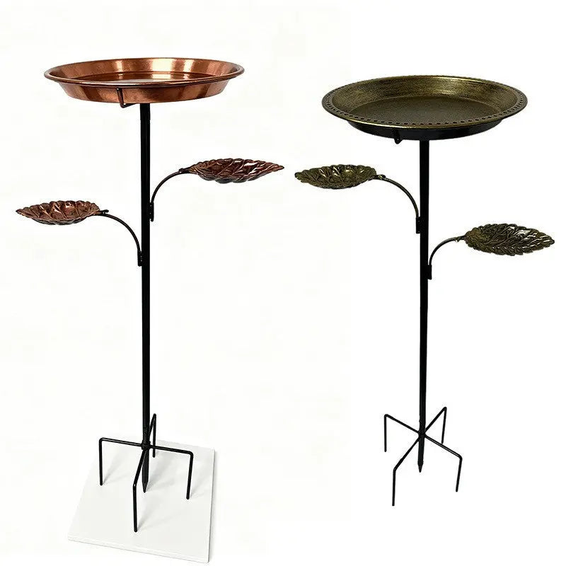 Metal ground insert bird feeder stake shown for garden installation