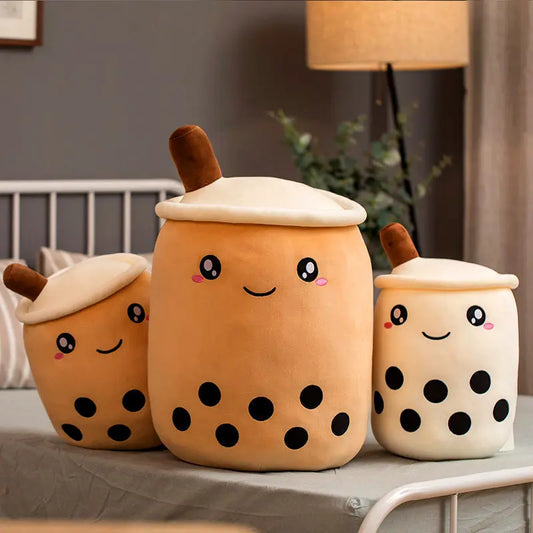 Bubble tea plush pillows in multiple sizes styled together with lamp and plant decor