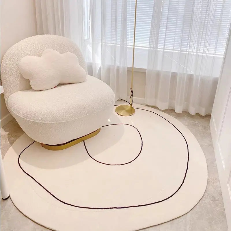 Cashmere-look round rug styled beneath an accent chair, alternate angle