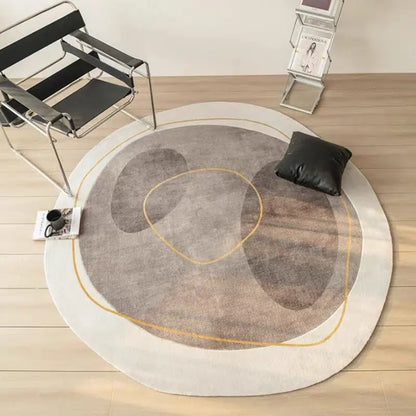Cashmere-look round rug in gray and mauve colorway in a full room setting