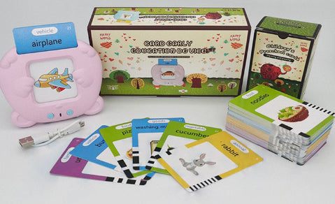 Everything included in the box: pink learning machine, USB charging cable, retail box and the full deck of double-sided word cards