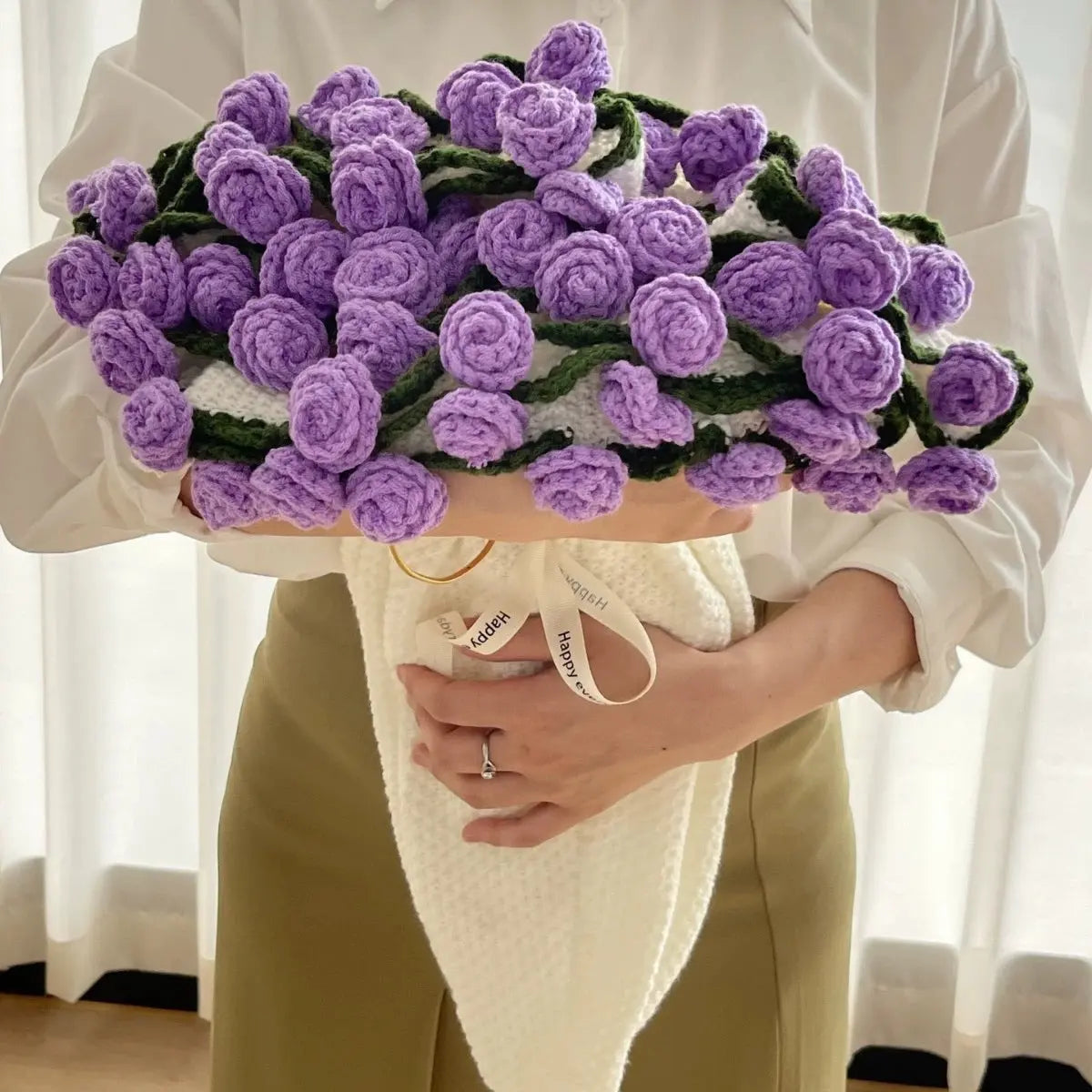 Close-up of the purple flower bouquet fold on the woven cotton blanket