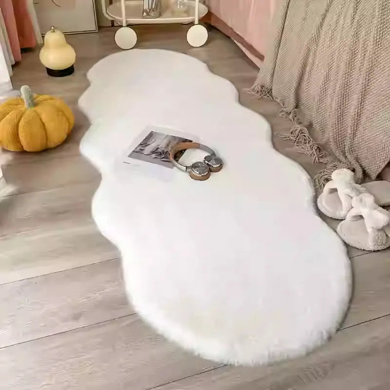 Close-up of the creamy area rug showing soft fluffy texture