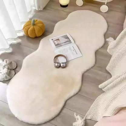 Creamy area rug with a warm yellow-toned styling in a bedroom setting
