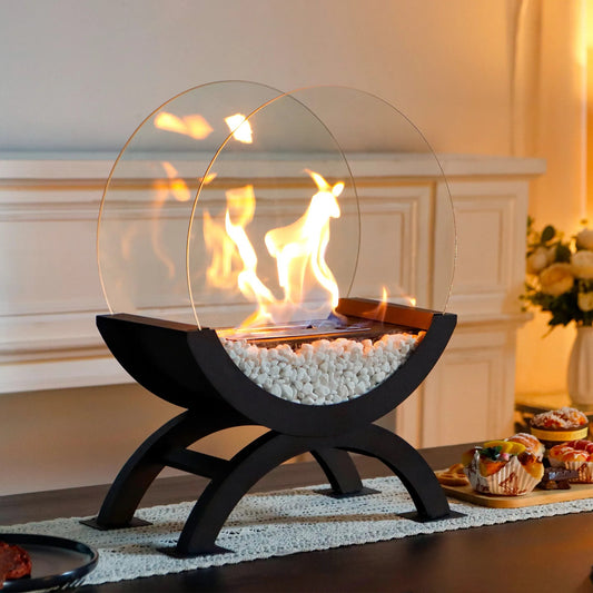 Desktop alcohol fireplace lamp with a lit flame styled on an indoor mantle