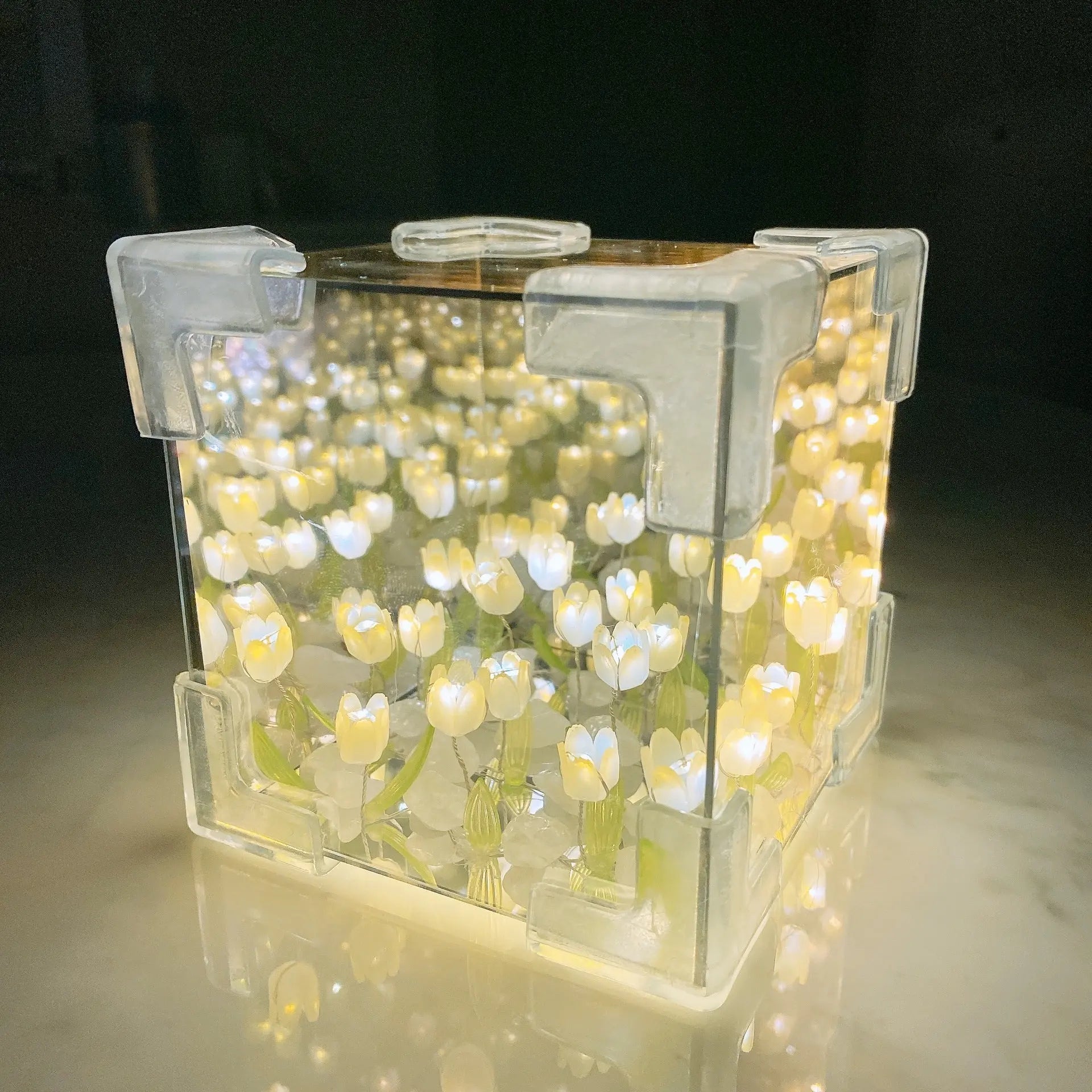 DIY tulip mirror night light kit assembled into a glowing yellow cube lamp