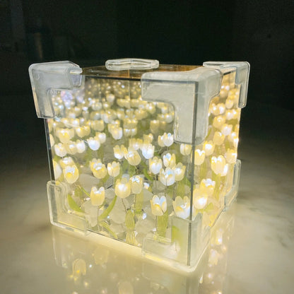 DIY tulip mirror night light kit assembled into a glowing yellow cube lamp
