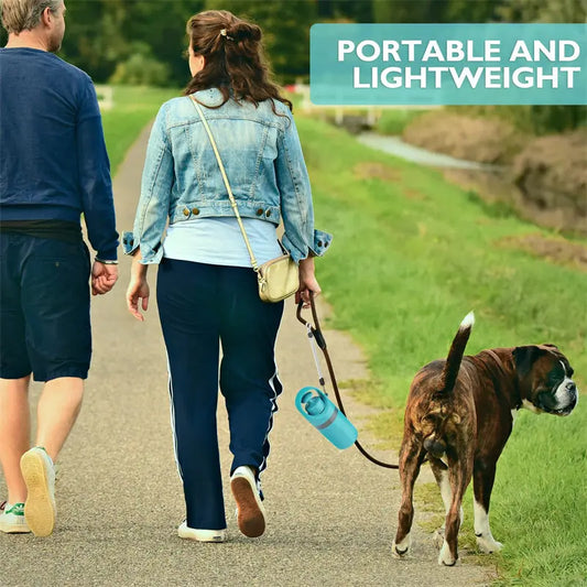 Couple walking a dog outdoors using the portable pooper scooper