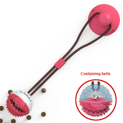 Silicone suction cup dog tug toy in green and pink on a white background