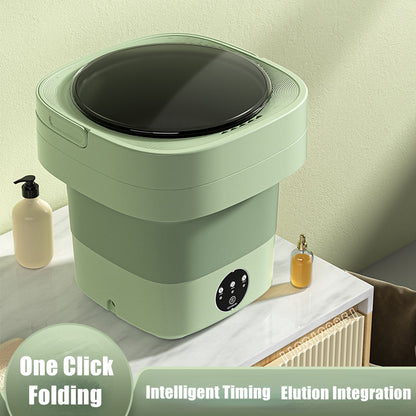 Green foldable washing machine open on a marble counter showing the three-button timer panel on the front