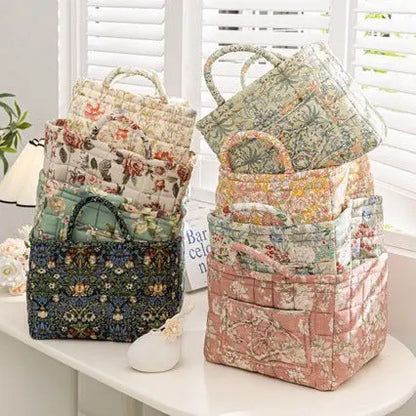 Floral cotton fabric storage baskets in multiple sizes and patterns styled on a table