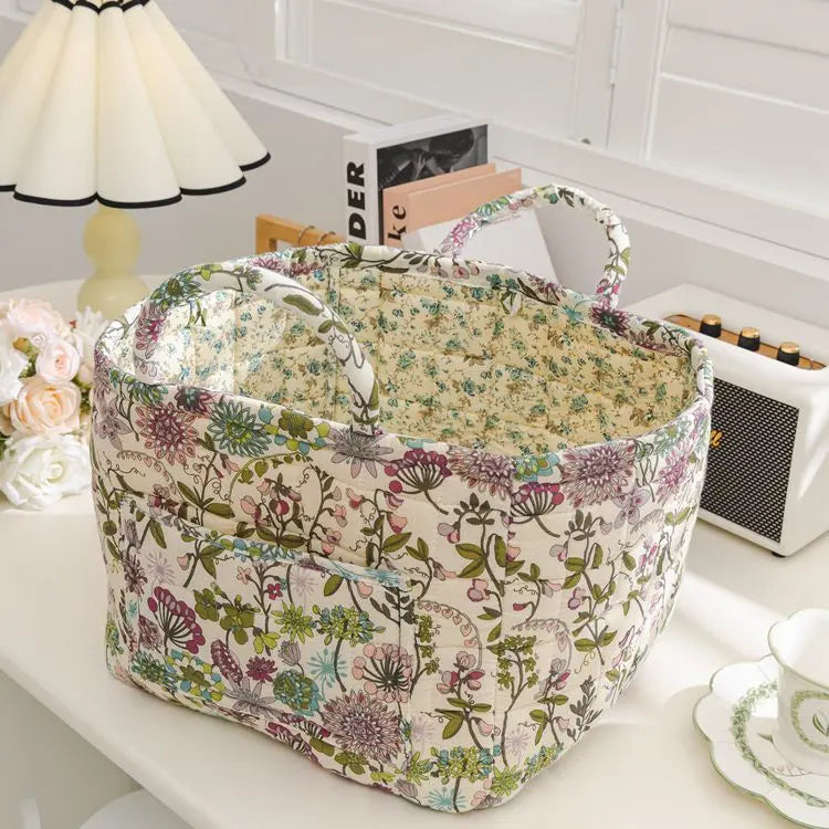 Floral cotton fabric storage basket in a Korean pastoral style pattern, styled on a table
