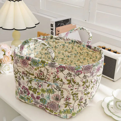 Floral cotton fabric storage basket in a Korean pastoral style pattern, styled on a table