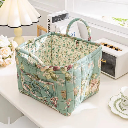 Floral cotton fabric storage basket in teal floral pattern