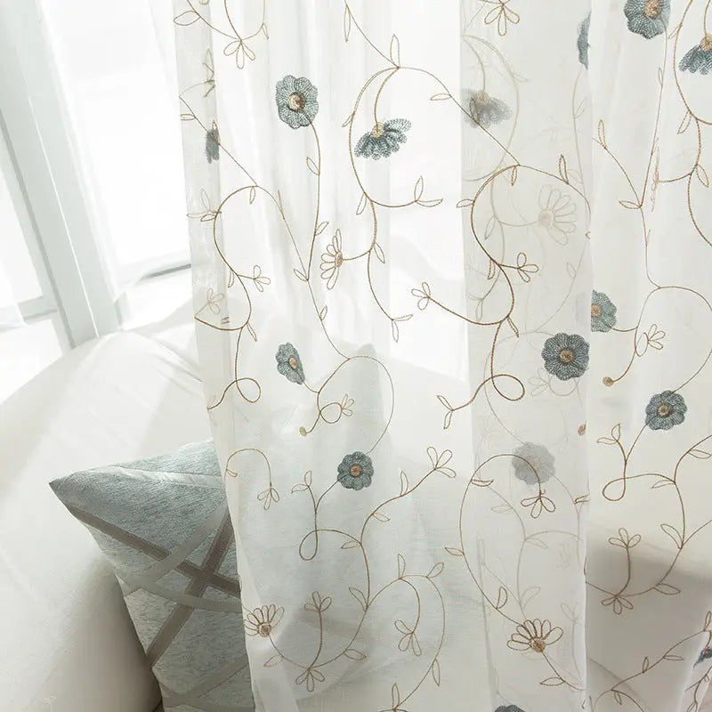 Close-up of the garden embroidered pattern on the sheer curtain fabric