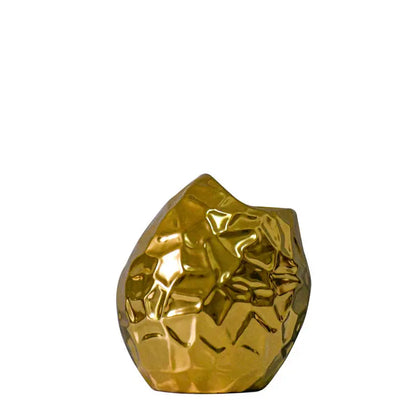 Gold-plated geometric ceramic vase styled on a shelf as home decor