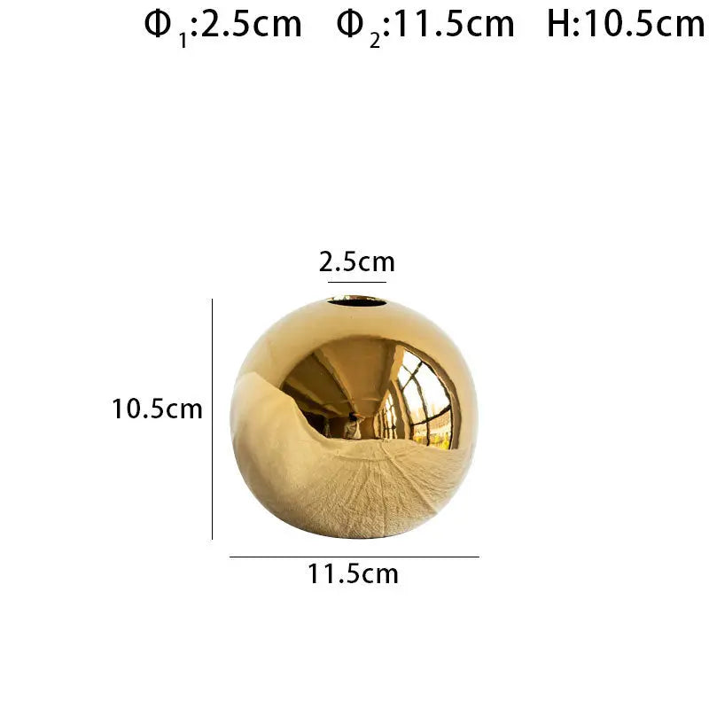 Close-up of the gold electroplated ceramic vase showing surface texture and finish