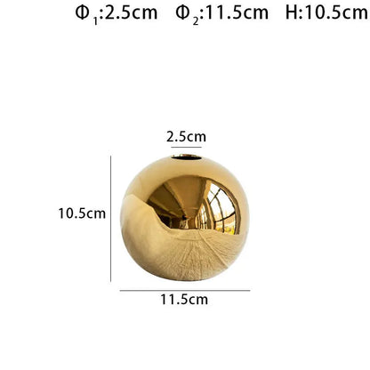 Close-up of the gold electroplated ceramic vase showing surface texture and finish