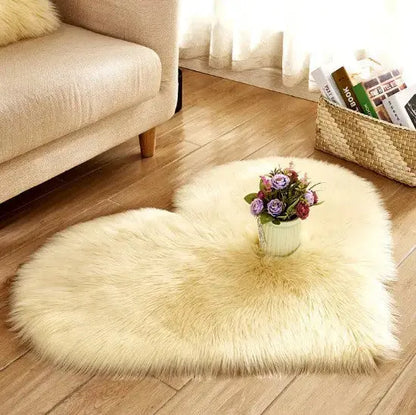 Cream heart-shaped fluffy rug styled with a flower vase accent