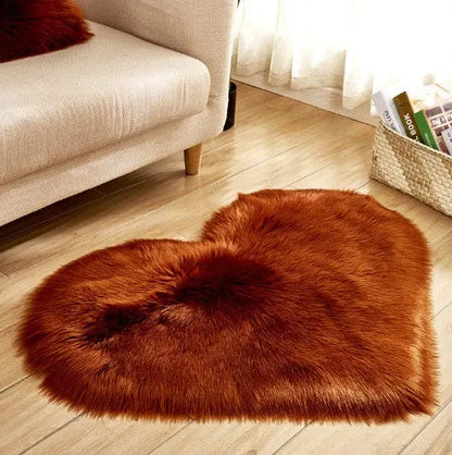 Heart-shaped fluffy rug shown with size dimensions