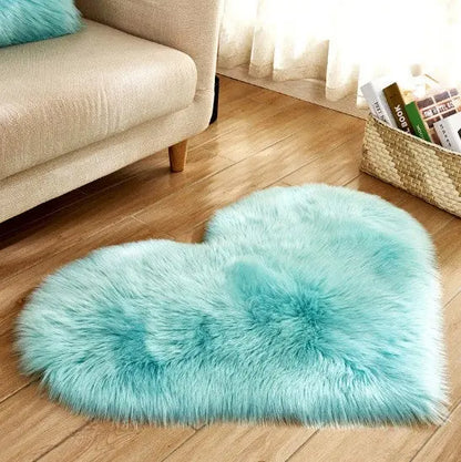 Heart-shaped fluffy rug in teal colorway styled on a floor