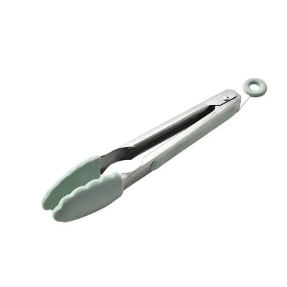 Kitchen utensil set demonstrating heat-resistant use while cooking