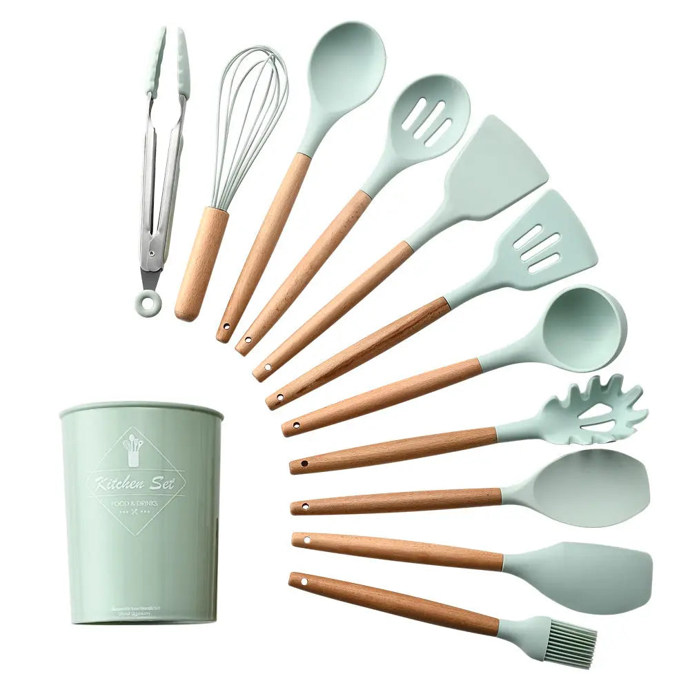 Silicone and wood handle kitchen utensils displayed in a holder stand
