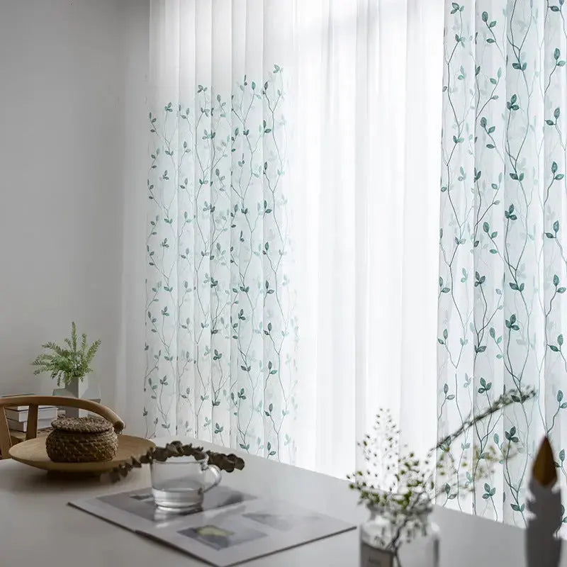 Teal pastoral embroidery gauze curtain styled in a room with matching teal decor accents