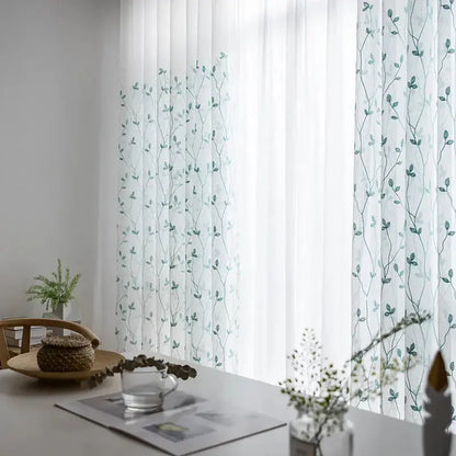Teal pastoral embroidery gauze curtain styled in a room with matching teal decor accents