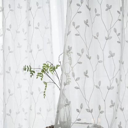 Pastoral embroidery gauze curtain in gray colorway styled in a room