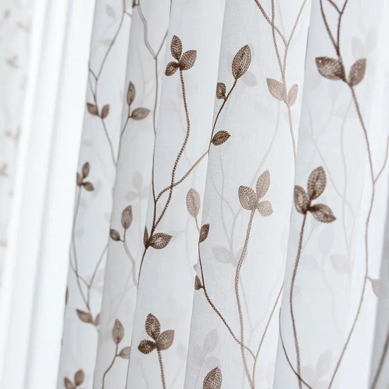 Pastoral embroidery gauze curtain in white styled in a bedroom window