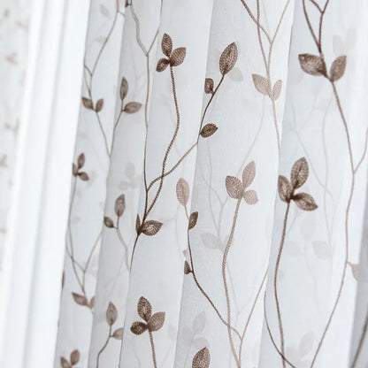 Pastoral embroidery gauze curtain in white styled in a bedroom window