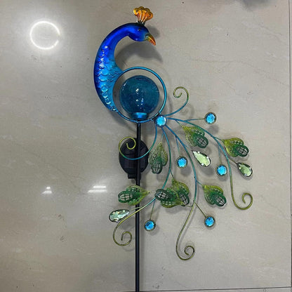 Close-up of the solar panel and ground stake on the peacock garden lamp
