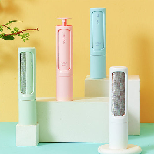 Reusable pet hair remover brush shown on a plain white background