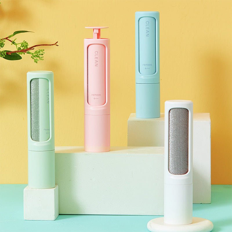 Reusable pet hair remover brush shown on a plain white background