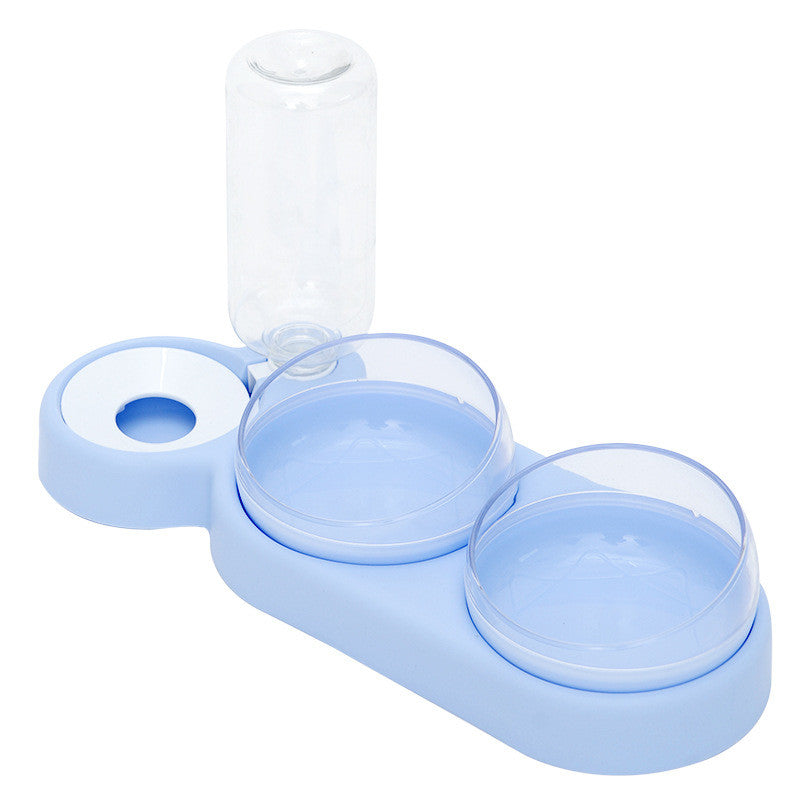 Dog drinking from the raised pet double bowl water fountain feeder