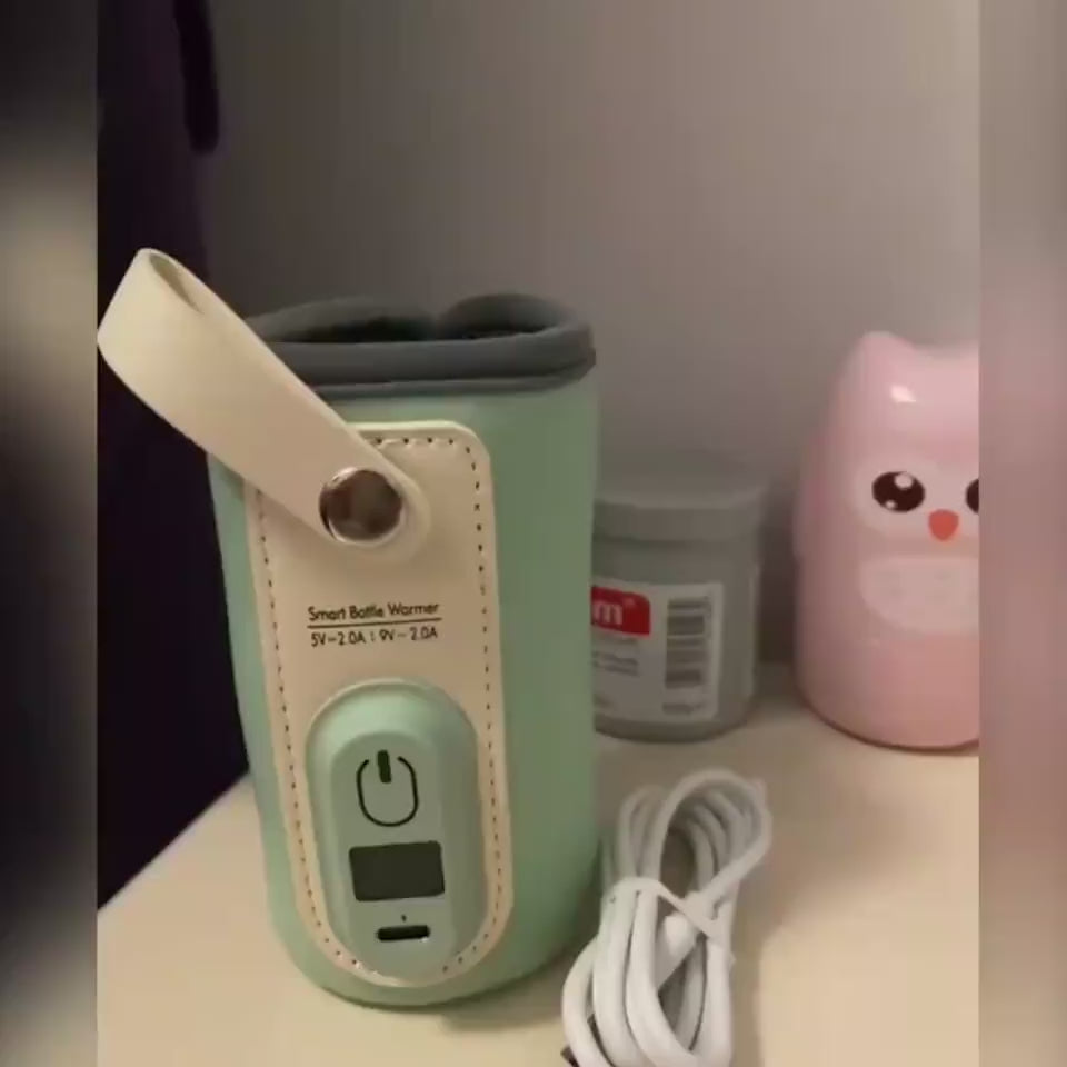 Bottle warmer sleeve in use, showing the temperature display and how it wraps around a bottle