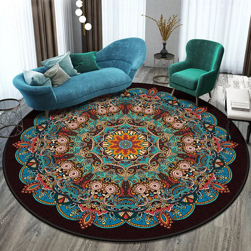 Round boho area rug with teal and orange mandala pattern on a wood floor