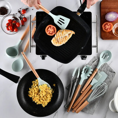 Silicone and wood handle kitchen utensils in use while cooking on a stovetop