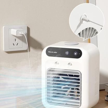 Portable USB air cooler fan plugged into an outlet with rotating fan blade detail