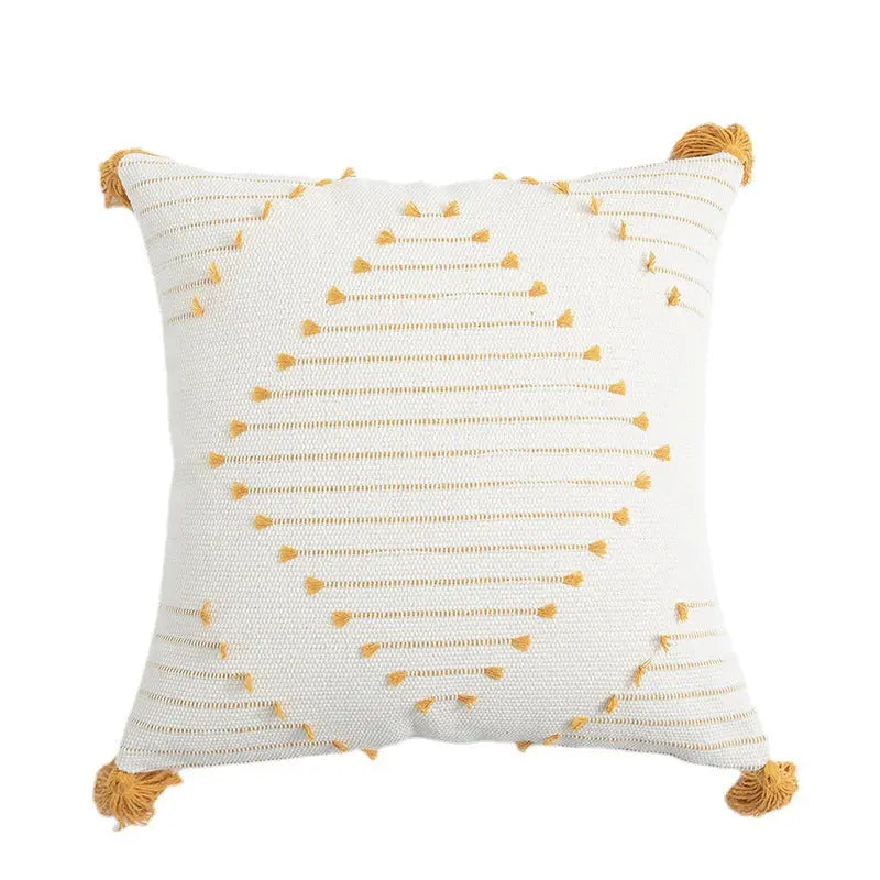 Yellow flower cushion cover styled in a bedroom setting