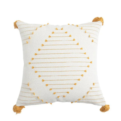 Yellow flower cushion cover styled in a bedroom setting