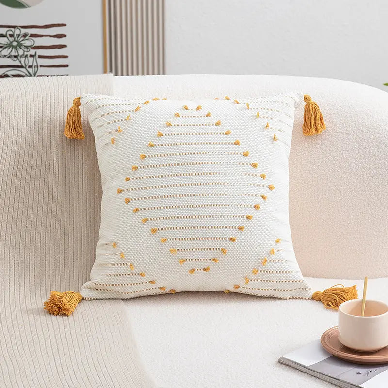 Yellow flower cushion cover in lumbar pillow shape styled on a sofa